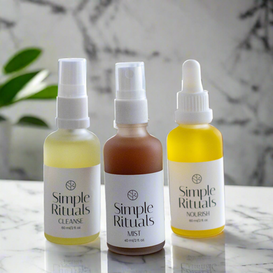 Simple Rituals - Cleanse, Mist and Nourish. 3 liquids in white frosted glass bottles with white caps and white labels